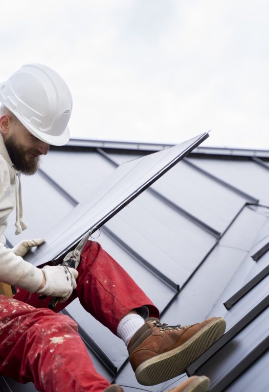 man-with-helmet-working-roof-full-shot-min
